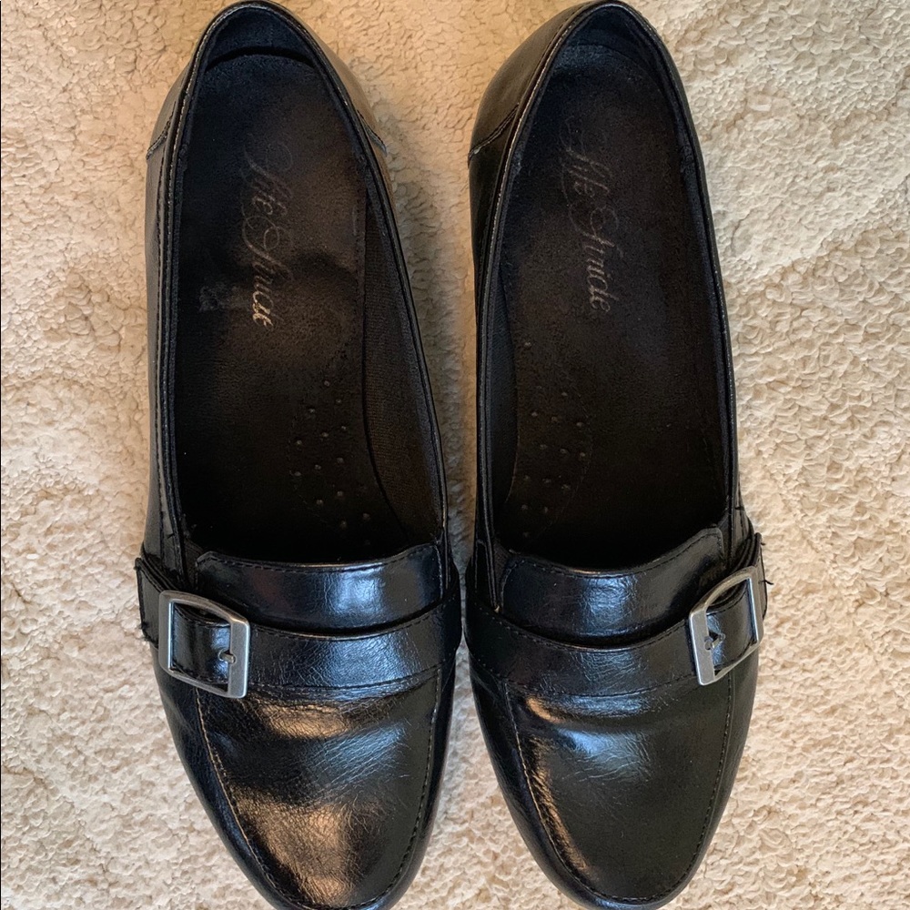 Black leather dress flats with silver buckle